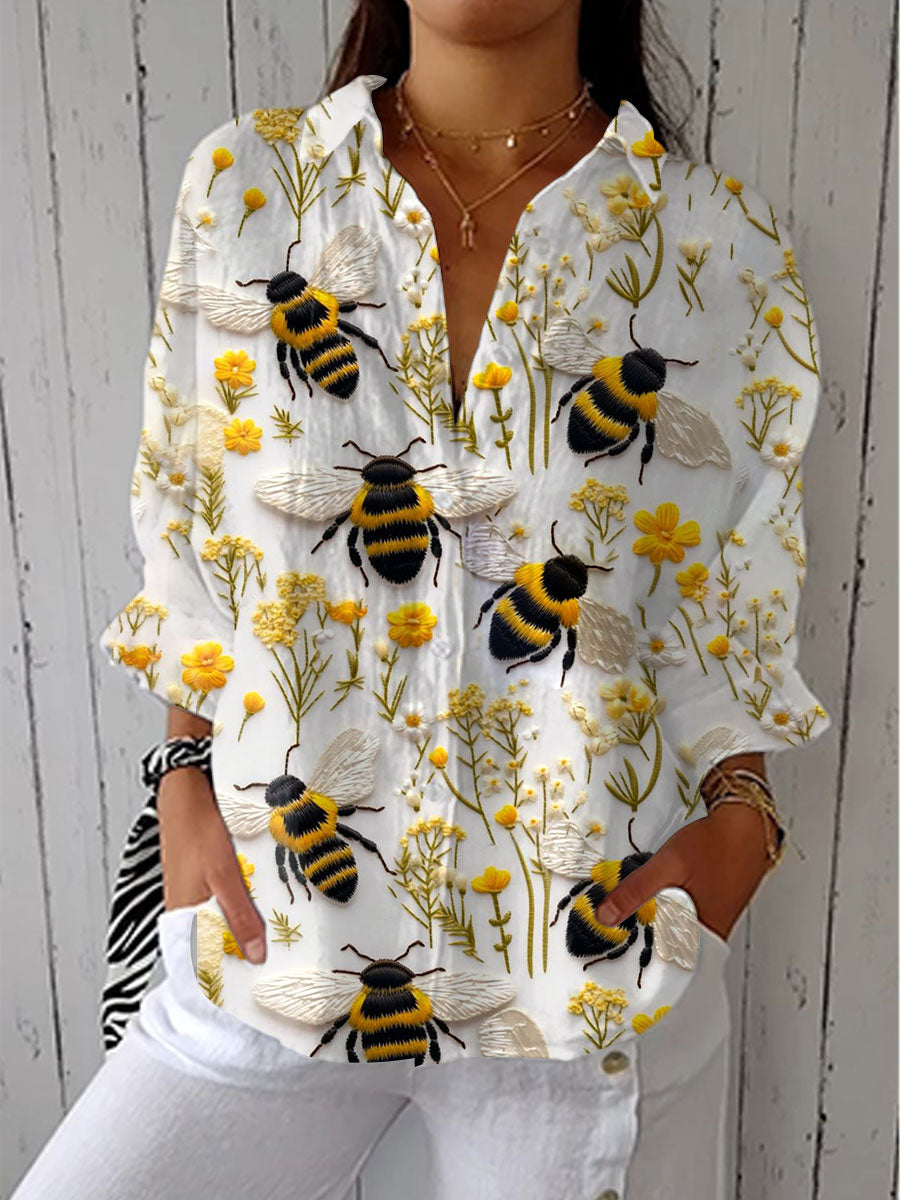 Fiorine | Bluse mit goldener Biene und Rundhalsausschnitt