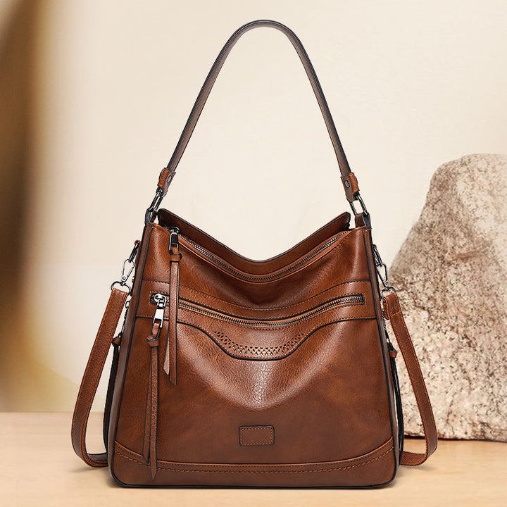 Malbjørg | Elegante Schultertasche für Damen mit wellenförmigem Design