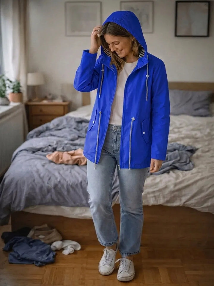 Impermeabile da donna con maniche lunghe, cappuccio e tasche