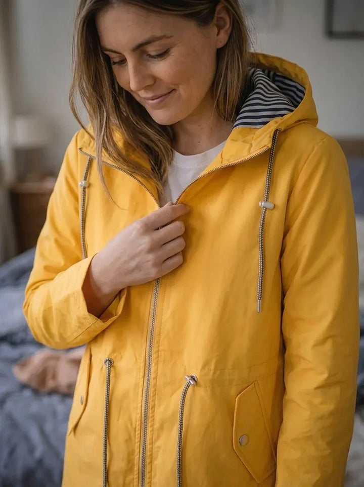 Impermeabile da donna con maniche lunghe, cappuccio e tasche