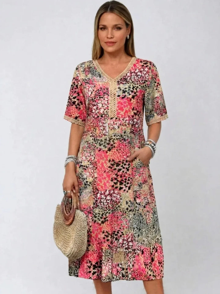 Fatima | Kleid für Damen mit Blumenmuster, V-Ausschnitt und kurzen Ärmeln