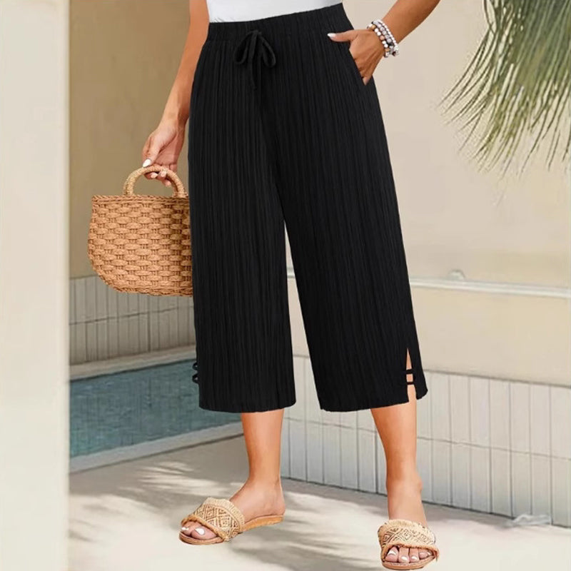 Weite Capri-Hosen für Damen mit praktischen Taschen und mittlerem Bund